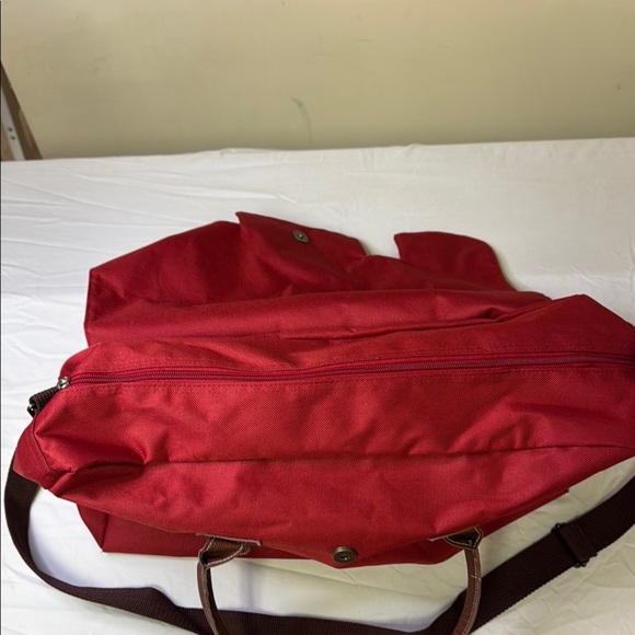 Red and Brown Travel Bag with Adjustable Strap and Sturdy Design - Picture 6 of 10